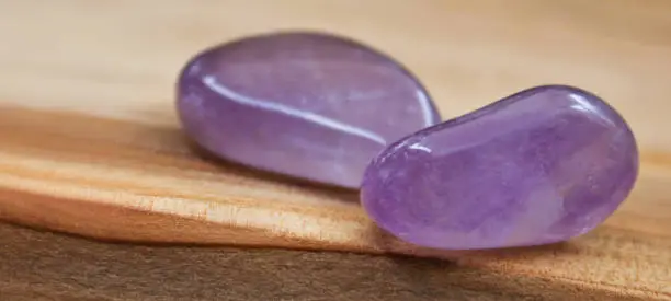 Amethyst against wooden background close up