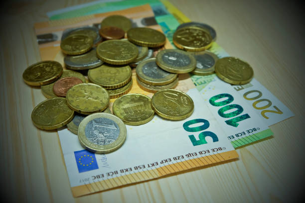 Euro coins and euro banknotes, black money concept