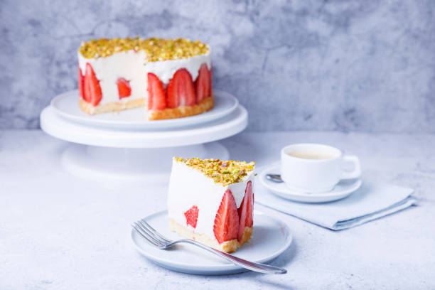 cake frezier with fresh strawberries and pistachios. french classic dessert. portion of cake on a white plate. - dieting food cake sponge cake imagens e fotografias de stock