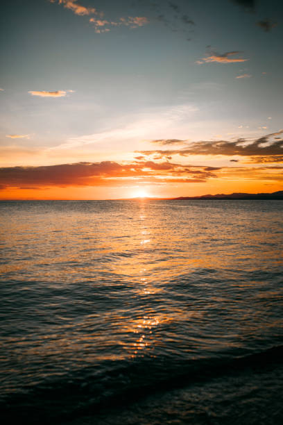 istock Beautiful orange sunset over sea 1325597529