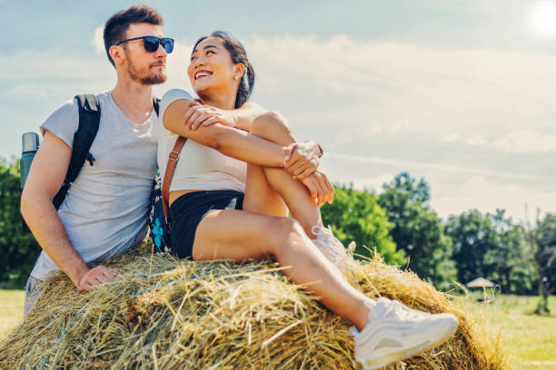 Couple enjoying summer day at the agriculture field
