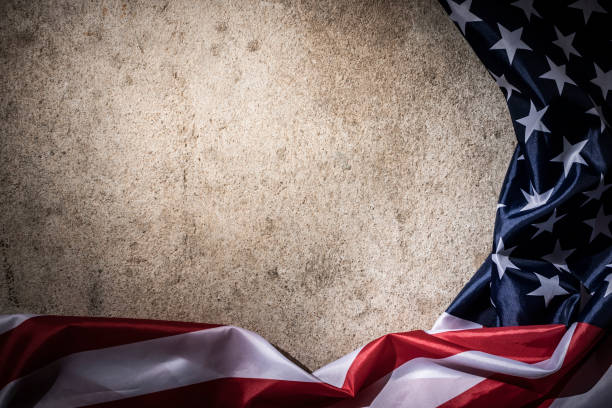 istock America flag of fabric with copy space concrete board background 1325600170