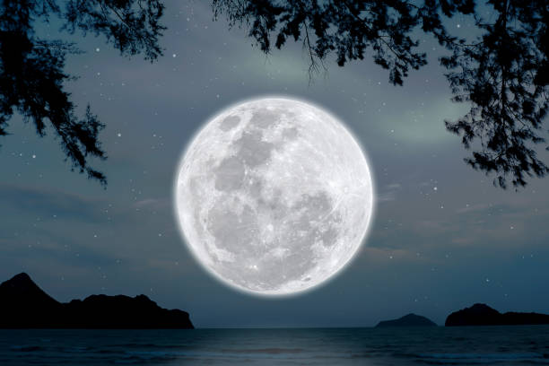 istock Full moon on sky over sea in the night. 1325601241