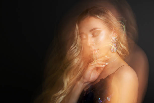 istock Fashionable girl with perfect makeup posing with mixed light 1325606818