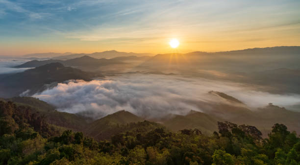 Beautiful morning Sunrise and Fog flow over mountain in Ai yerweng, Yala, Thailand stock photo
