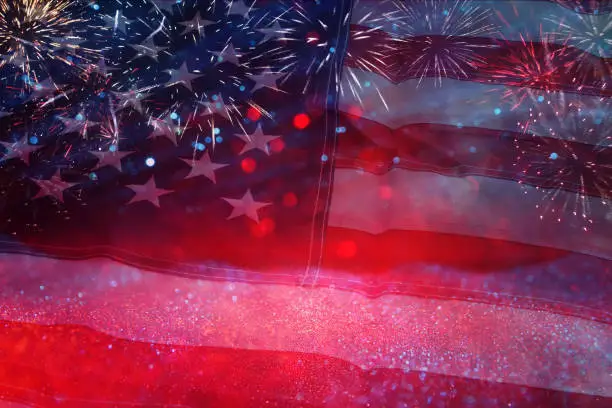 American flag with glitter bokeh background and fireworks