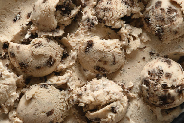 istock Pattern of creamy ice cream with cookies in balls. 1325612830