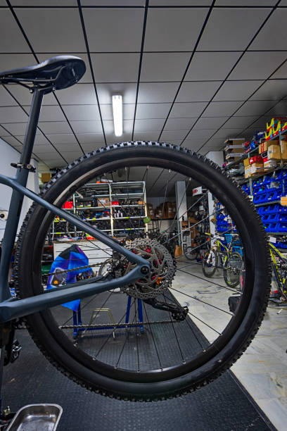 istock bicycle repair mechanic in workshop 1325612972