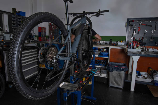 istock bicycle repair mechanic in workshop 1325612973