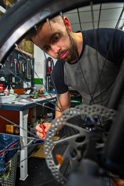 istock bicycle repair mechanic in workshop 1325612977