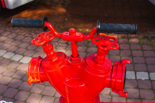 istock Vintage Red Fire Hydrant on the Sidewalk in an amusement park, Fire Extinguishing Equipment 1325613864