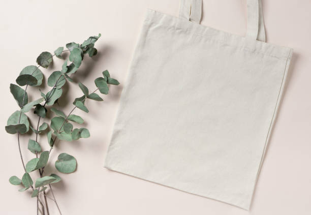 istock Mockup empty template White cream shopping bag for your design, eco friendly, zero waste with copy space. Eucalyptus branches. Flat lay. 1325616555