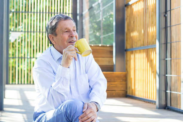 istock Smiling senior man enjoying in morning coffee 1325619982