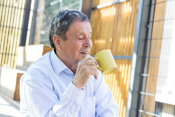 istock Smiling senior man enjoying in morning coffee 1325620016