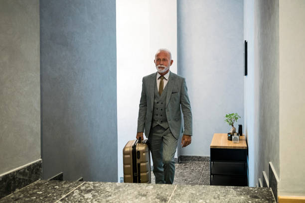 istock Senior businessman checking in hotel 1325620873