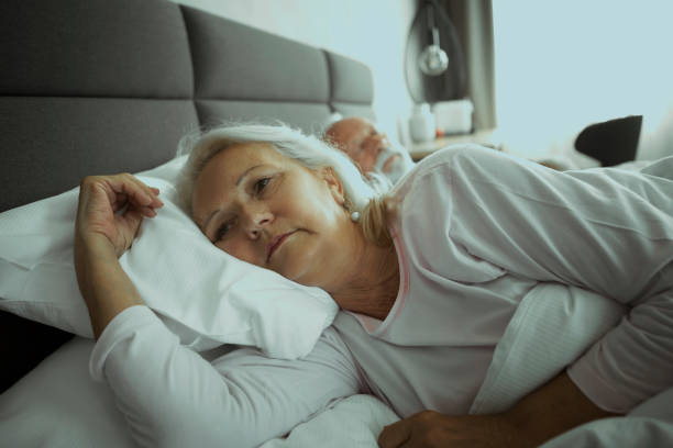 senior couple sleeping ,senior woman having sleeping problem - insomnia imagens e fotografias de stock