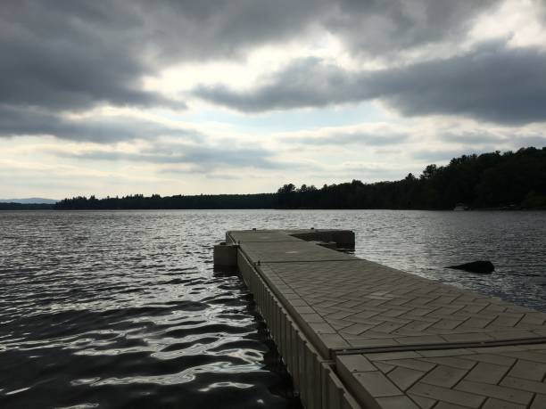istock Dramatic silver sky reflects on the lake by the dock 1325622910