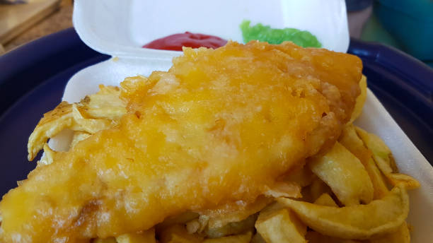 istock Traditionally British take away fish chips and mushy peas served in a tray. 1325631280