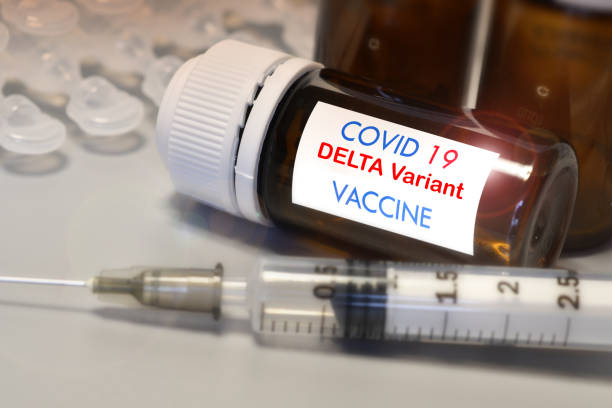 Covid-19 Delta variant strain vaccine. Syringe and vaccine. Treatment for coronavirus covid-19. stock photo