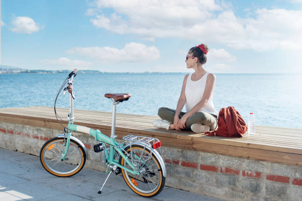 istock young woman using bicycle in the city 1325632236