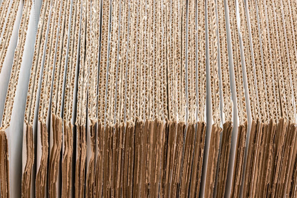 istock corrugated cardboard box stack in the production conveyor for packaging 1325632439