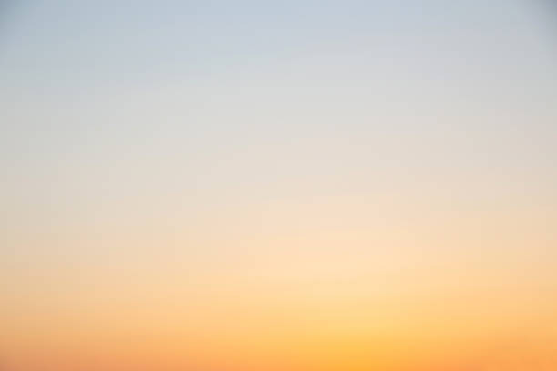 istock sunset sky, painted with a gradient in yellow tones, natural background 1325636281