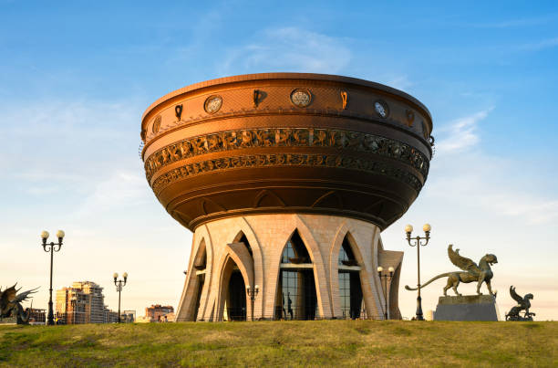 Kazan Wedding Palace (Family Center) in summer, Tatarstan, Russia. It is landmark of Kazan. Unusual building against blue sky, tourist attraction in Kazan city center. Travel and tourism concept.