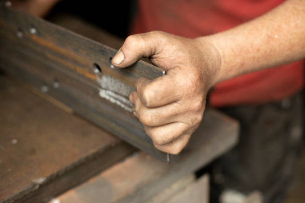 istock Drilled holes in the metal. Work in a metal workshop. 1325646155