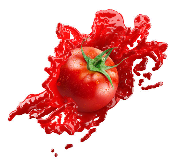 istock tomato in juice splash isolated on a white background 1325647815