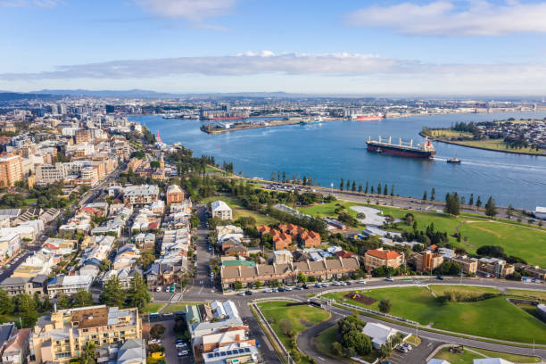 Aerial view Newcastle NSW Australia Ship entering newcastle harbour one of the largest coal export ports in the world. - Newcastle NSW Australia newcastle new south wales photos stock pictures, royalty-free photos & images