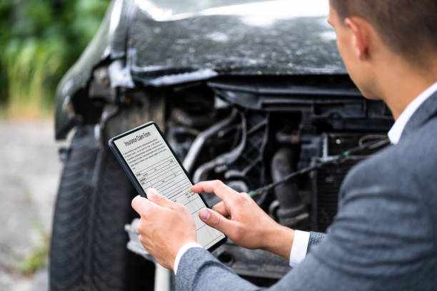 istock Insurance Agent Inspecting Damaged Car 1325656092