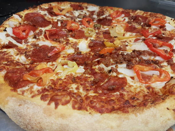 istock Home made vegie and peperoni pizza 1325656254