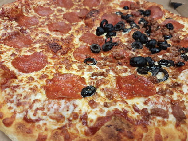 istock Home made vegie and peperoni pizza 1325656619
