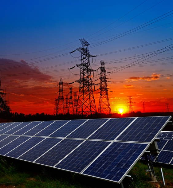 istock Solar panels and electric tower, green energy 1325657451