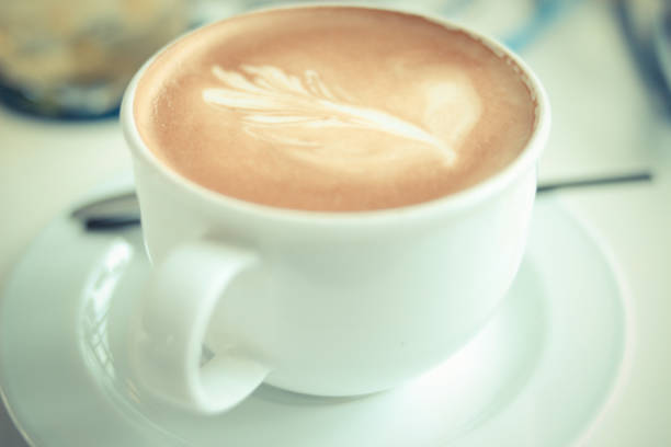 A close up shot of a cup of cappuccino