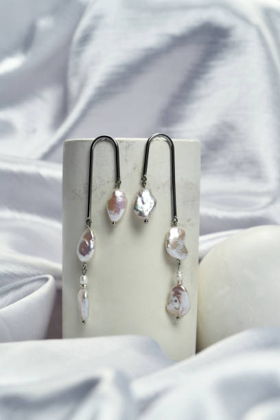 istock Elegant silver dangle earrings with natural pearls 1325662150