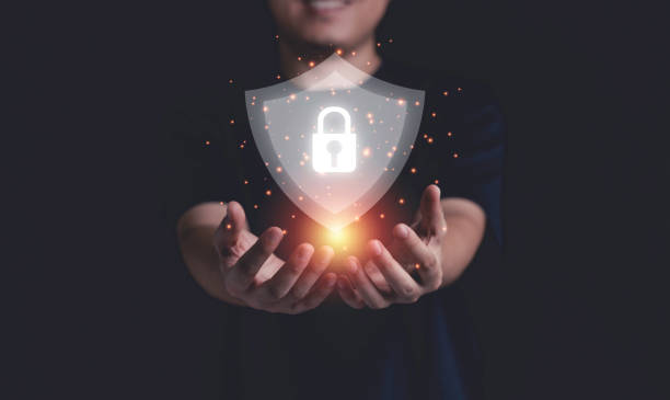 istock Businessman holding cyber security and information technology network system protection. 1325662335