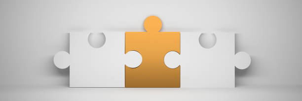 Wide banner with three puzzle pieces - one golden and two white pieces on white background