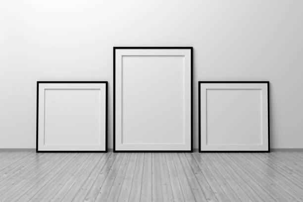 istock Mockup template of two vertical A4 frame with thin black frame border standing next to wall on wooden floor 1325667413