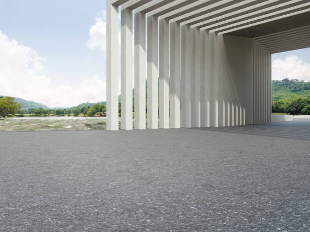 istock Abstract architecture design of modern building. Empty parking area floor and concrete wall with mountain and blue sky lake view. 1325676274