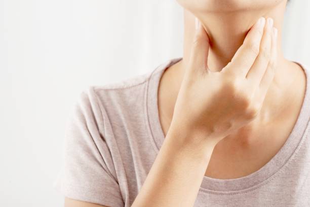 istock A woman has a cough, cold, sore throat, phlegm. 1325678322
