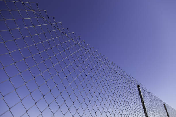 istock Metal fence with blue sky 1325681799