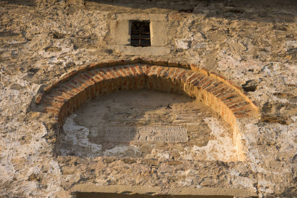 istock Romania,Humor Monastery,2017,old painted wall ,brick arch 1325691118