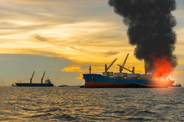 istock Large general cargo ship for logistic import export goods and other the explosion and had a lot of fire and smoke at sea in evening 1325695538