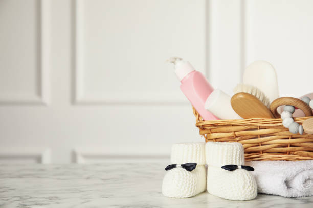 istock Baby booties and accessories on white marble table indoors. Space for text 1325697434