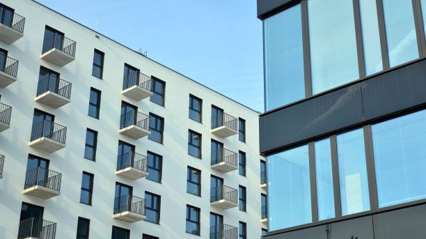 istock A residential building and an adjacent office building. 1325697682