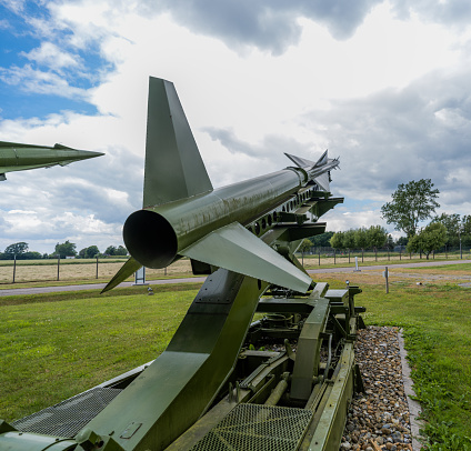 Air-to-air missile hanging under wing of military plane