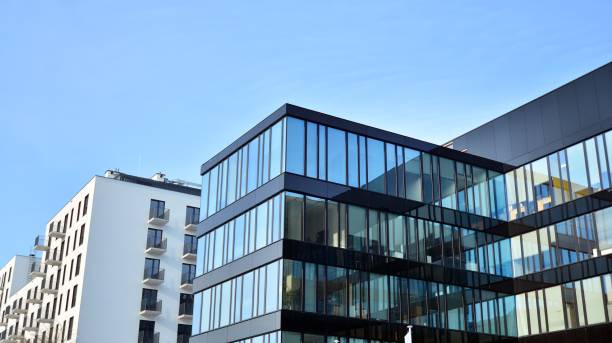 istock A residential building and an adjacent office building. 1325698524