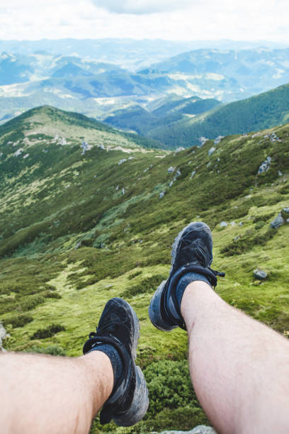 istock legs on the top of the peak 1325700970