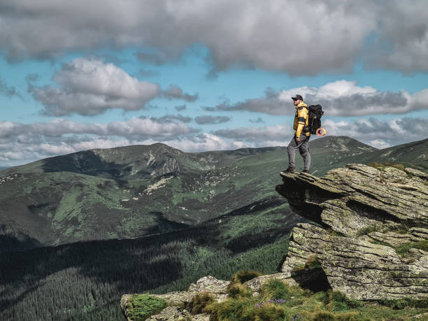 istock young hiker man in mountains. summer trekking path 1325701073